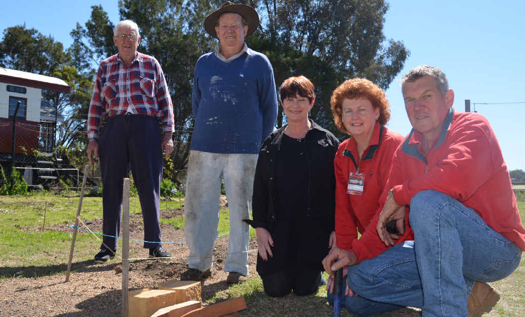 COMMUNITY CENTRED: Southern Downs Steam Railway volunteers John Brady and Bob Keogh, with Warwick Collective president Julia Keogh and Bunnings Warehouse Warwick staff Helen McDonald and Alan Gersbach, are getting ready for stage two of the community garden.